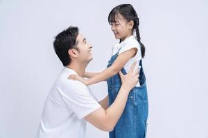 Image of Asian father and daughter on background photo