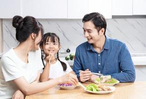 Image of Asian family in the kitchen photo