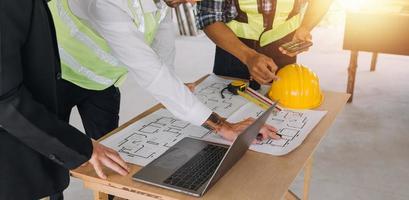 Architect concept, Architects working with blueprints in the office, Vintage Effect photo