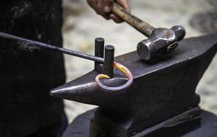 Striking iron in forge photo