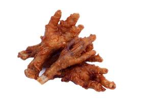 Fried crispy chicken feet isolated on white background. Concept, weird, exotic food. delicious and popular street food in Thailand photo