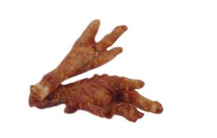 Fried crispy chicken feet isolated on white background. Concept, weird, exotic food. delicious and popular street food in Thailand photo