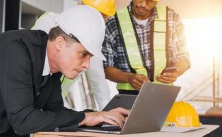 Architect concept, Architects working with blueprints in the office, Vintage Effect photo