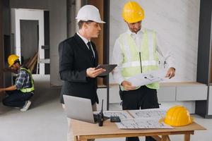 Architect concept, Architects working with blueprints in the office, Vintage Effect photo