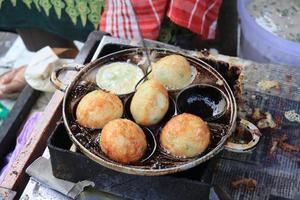 Fried eggs are usually called SD snacks in Indonesia which have been shaped and cooked ready to be put in a container and given toppings photo