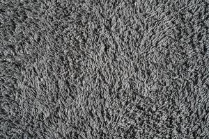 Gray background from microfiber fabric, idea for wallpaper or screen about materials. Synthetic matter photo
