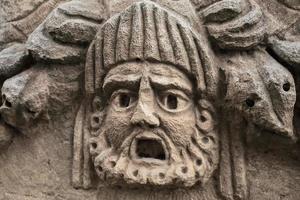 Theatrical mask, fragment of theater decoration with beautiful marble carving, history and heritage of ancient civilizations in the Aegean region of Turkey, vacation travel photo