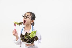 Asia little girl playing doctor isolated on white photo