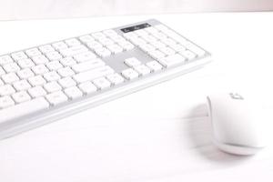 White wireless keyboard and mouse on table, pc equipment photo