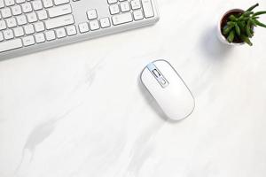 White wireless keyboard and mouse on table, pc equipment photo