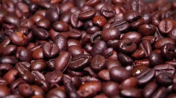 Freshly roasted coffee beans close up video