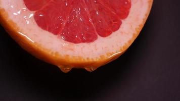 Liquid honey dripping from grapefruit video