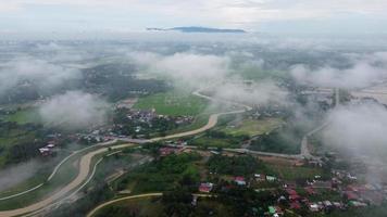 Drone view Malays village in misty cloudy video