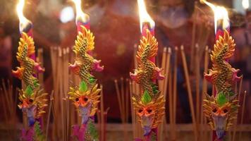 Select focus dragon incense stick during pray at Chinese temple video