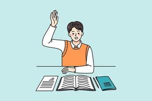 Active schoolboy sitting at desk in class raise hand volunteer to answer. Smart boy child participate in discussion at lesson. Clever kid at class. Education concept. Vector illustration.