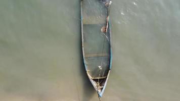 Aerial view sinking boat near the shore video