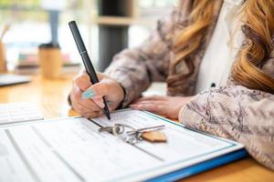 Real estate purchase documents are prepared within the real estate trading office for clients who wish to purchase real estate to sign a document confirming the completion of the purchase. photo