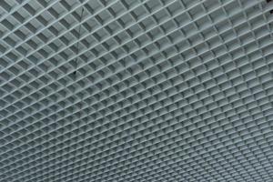 grid ceiling background is beautiful because it is designed to cover traces of original ceiling resulting in modern grid ceiling pattern. backdrop of ceiling is decorated with steel in grid pattern. photo