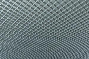 grid ceiling background is beautiful because it is designed to cover traces of original ceiling resulting in modern grid ceiling pattern. backdrop of ceiling is decorated with steel in grid pattern. photo