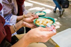 Tourist try special traditional local desert in Isfahan photo