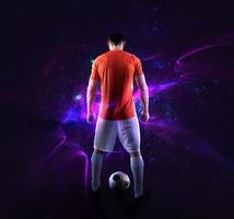 Football scene with soccer player in front of a futuristic digital background photo