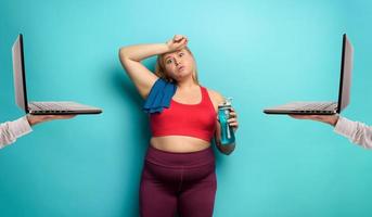 Fat girl does gym at home but she always thinks about sweets. Cyan  background 26389266 Stock Photo at Vecteezy