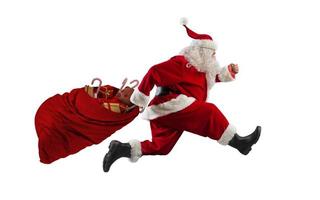 Santa claus runs fast to deliver all gifts photo