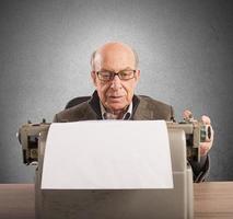 Elder writes with typewriter photo