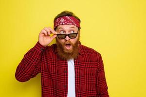 Wondered man with beard and bandana in head photo