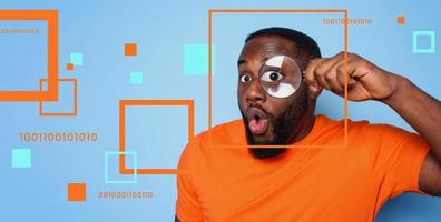 Man search for digital information with a magnifier lens. Concept of internet security and privacy photo