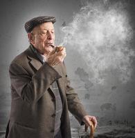 Old man smoking pipe photo