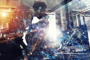 Teamwork works with a computer. Concept of internet sharing and interconnection. double exposure. photo