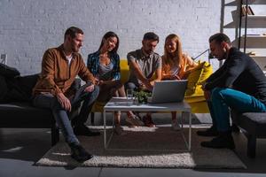 Business people that work together in office with a laptop photo