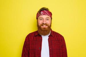 Happy man with beard and bandana in head photo