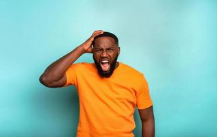 Man with stressed and exhausted expression is desperate photo