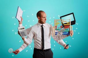 Businessman who daoes a lot of tasks simultaneously. concept of owerwork and multitasking photo