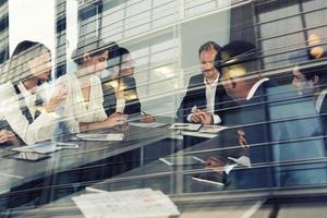 Businessmen that work together in office. Concept of teamwork, partnership and startup. double exposure photo