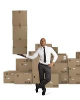 Businessman holds a pile of packages in a hand. concept of fast delivery photo