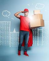 Courier acts like a powerful superhero. Concept of success and guarantee on shipment. Studio cyan background photo