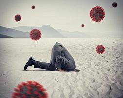 Man hides himself like an ostrich due to coronavirus covid19 problem in the air photo