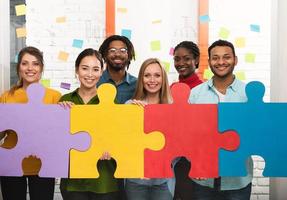 Teamwork of partners. Concept of integration and startup with puzzle pieces photo