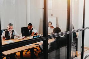 Group of business people have a meeting about company stats photo