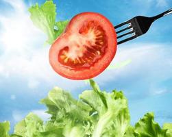 Background of mixed salad with a fork photo