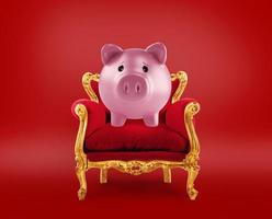 Comfortable red and golden armchair with a piggybank. Concept as premier savings service photo