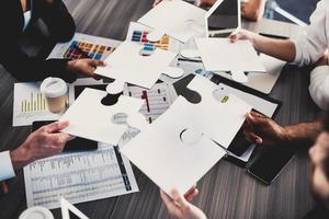 Teamwork of partners. Concept of integration and startup with puzzle pieces photo