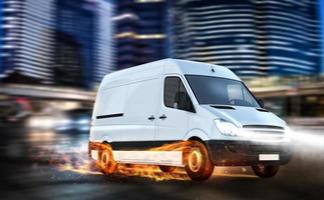 Super fast delivery of package service with van with wheels on fire. photo