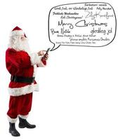 Santa claus sends greeting messages by smartphone photo