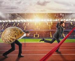 Businessman wins against a competitor slow like a snail photo