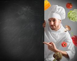 Chef with blackboard photo
