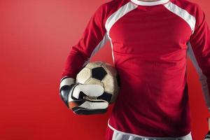 Goalkeeper ready to play with ball in his hands photo